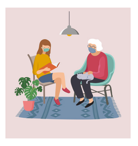 Volunteer reading to a patient