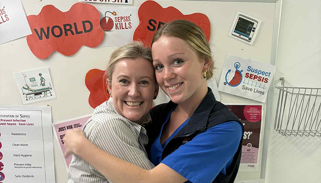 Two happy females who have experienced the traineeship program.